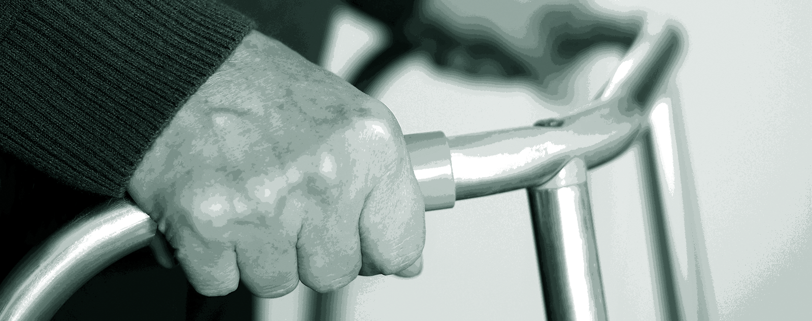 close up of hands holding zimmer frame