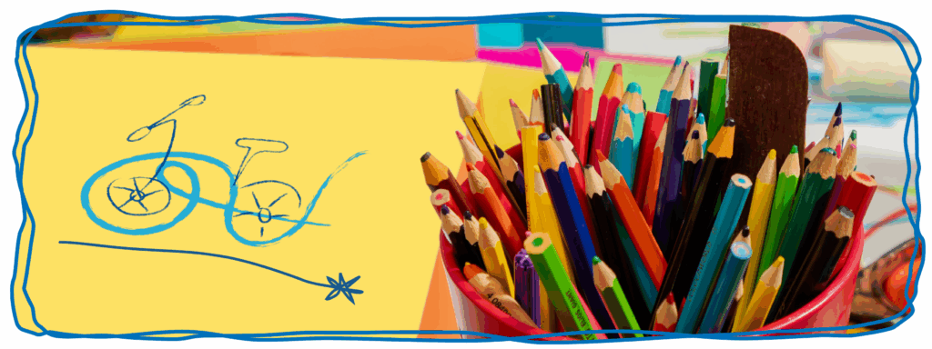Image of an art therapy drawing on yellow paper with colourful pencils in a pot.