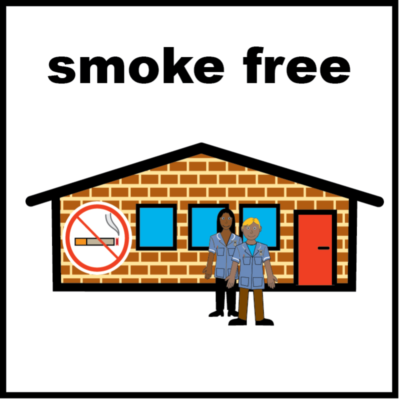 A building with a no smoking sign on the side of it.