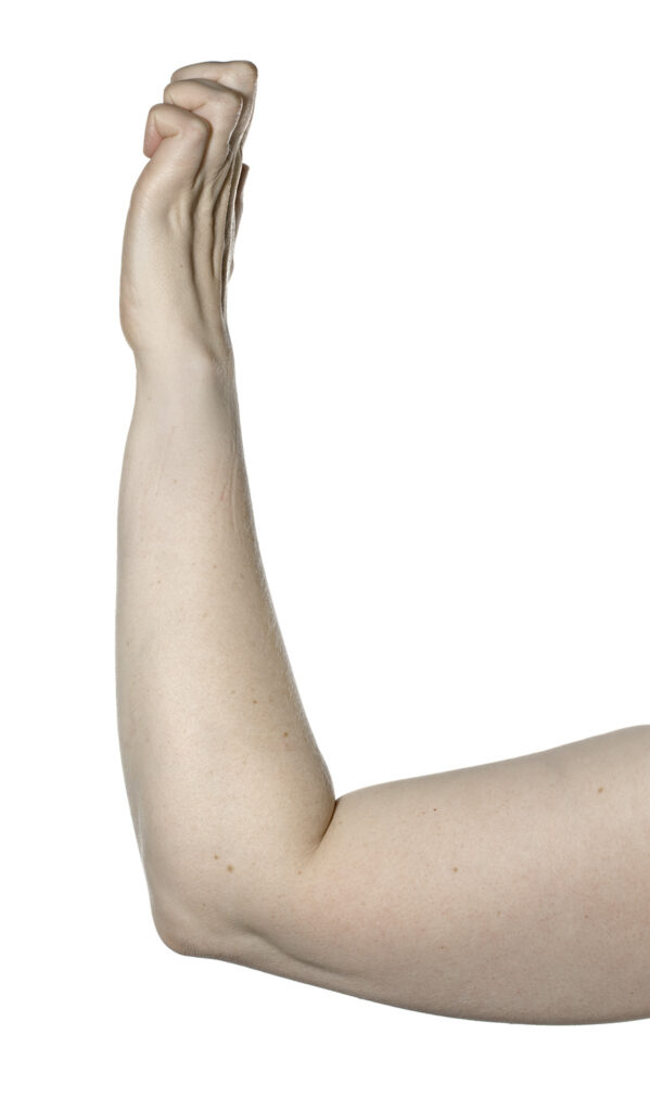 Picture shows elbow resting on a table, arm raised, hand curled and fingers open without making a full fist.
