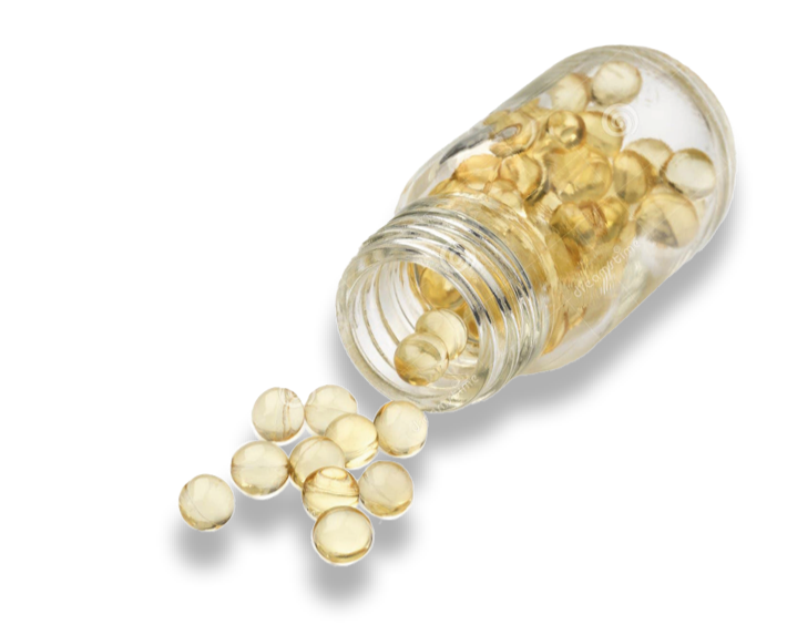 Vitamin D tablets spilling out of a bottle.